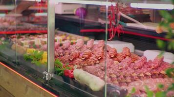 Medium shot of window shop in meat department in butchers store. video