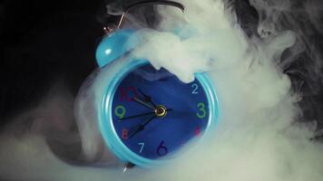 BLue Table Clock with Colorful Numbers in a Smoke Ambiance video