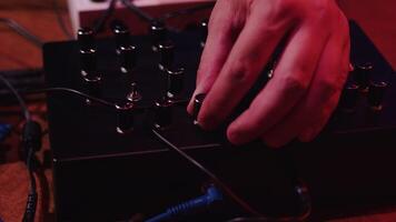 Musician playing synthesizer using multiple knobs video
