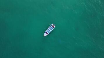 Aerial top view of a boat starting its engine in the Caribbean Sea along the coast of the Dominican Republic. The concept of adventure, tourism, the power of nature and the passion for travel. video