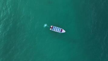 Aerial top view of boat anchoring and starting its engine in Caribbean Sea along the coast Dominican Republic. The concept of adventure, tourism, the power of nature and the passion for travel. video