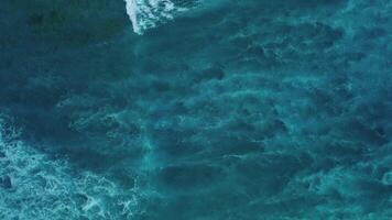 Aerial top view beautiful texture of big power dark ocean waves with white wash video