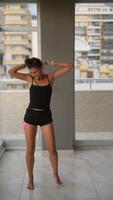 An energetic dance move is displayed in a contemporary setting that is captivating video