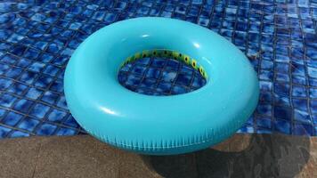 an inflatable ring sitting in a pool video