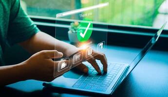Person Making Online Payment with Credit Card on Laptop, Holographic Interface Showing Payment Successful and Shopping Icons, Representing E-commerce and Digital Transactions photo