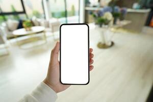 Women's hands holding cell telephone blank copy space screen. smartphone with blank white screen isolated. smart phone with technology concept photo