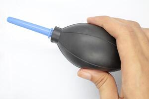 A dust air blower in hand isolated on a white background photo