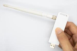 Wireless USB, tool for connecting internet signal to laptop or computer isolated on white background. photo
