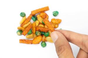 A pile of assorted mixed nuts, healthy snacks, salty snacks and snacks, on a white background photo