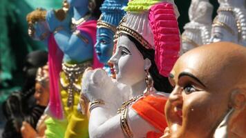 Colorful mythological sculptures displayed in a handicraft shop photo