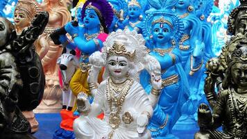 Colorful mythological sculptures displayed in a handicraft shop photo