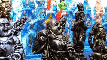 Colorful mythological sculptures displayed in a handicraft shop photo