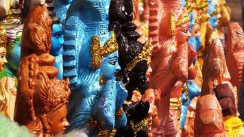 Colorful mythological sculptures displayed in a handicraft shop photo