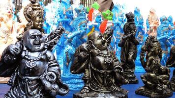 Colorful mythological sculptures displayed in a handicraft shop photo