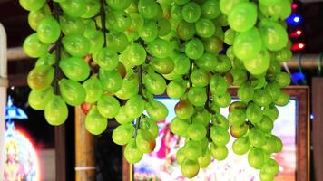 Artificial grape fruits displayed in a handicraft shop photo