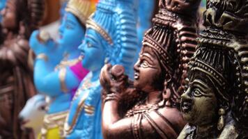 Colorful mythological sculptures displayed in a handicraft shop photo
