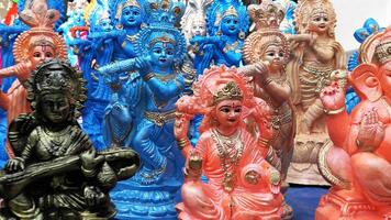 Colorful mythological sculptures displayed in a handicraft shop photo