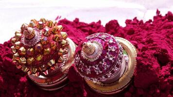 Traditional Indian cosmetic powder with Vermilion container displayed in a shop photo