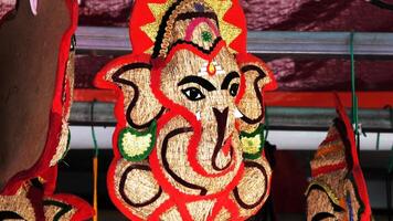 Decorative work of Lord Ganesha displayed in a handicraft shop photo