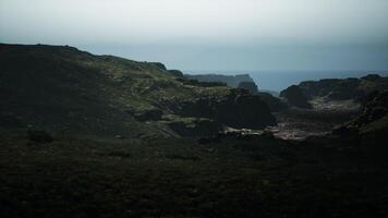 A view of the ocean from the top of a hill. mountain path video