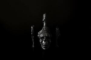 Halloween background with skull that have candle on it with another candles on black background. Minimal concept. photo