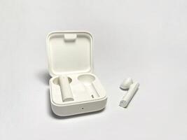 White earphones isolated on a white background with copy space for text photo
