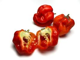 Habanero red chili. Sliced red hot chili peppers on a white background, closeup of photo