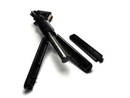 Broken mobile phone tripod isolated on white background with clipping path. Studio shot. photo