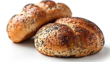 Two breads with bobby seeds isolated on white background. Bakery symbol. Natural food. photo