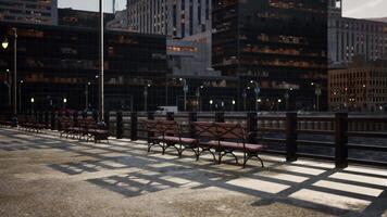 A row of benches sitting on top of a sidewalk video