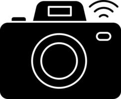 A black and white photo camera with wifi symbol vector