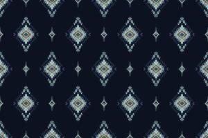 Ethnic floral Indian Pattern.Ikat pattern Ethnic Pattern.Border indian floral Aztec embroidery border seamless patterns. daimond motifs on dark navy background. vector