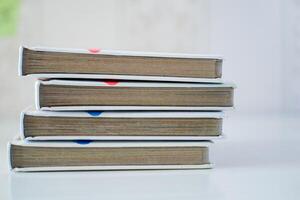 Stack of children story books on the white table photo