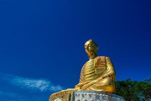 The Buddha statue in Prachuap Khiri Khan, Thailand is located on an island next to the sea. photo