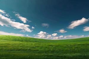 A green field with clouds and grass photo