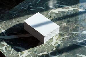 A stack of white cards on a marble table photo