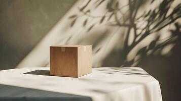 A box sitting on a table in front of a window photo