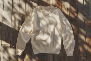 A sweater laying on a wooden floor photo