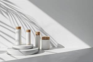 White vases and wooden sticks on a white surface photo