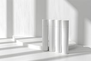 Three white bottles on a white surface photo
