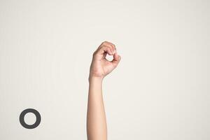 Deaf Sign alphabet of O, American Sign Language ASL. Isolated object Finger spelling the alphabet photo