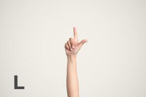Deaf Sign alphabet of L, American Sign Language ASL. Isolated object Finger spelling the alphabet photo