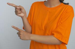 A person pointing with both hands photo