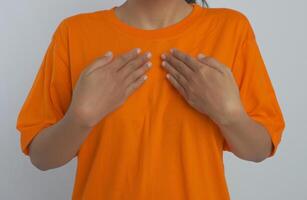 A person with their hands on their chest. Sign language photo
