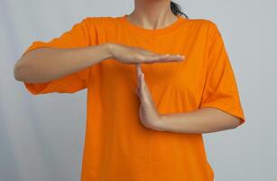 A person making a time out gesture with both hands photo