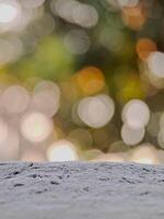 blurred background with soft, circular bokeh lights and a textured foreground. Perfect for serene designs. photo