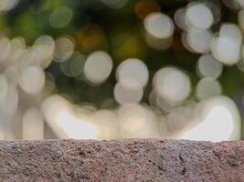 blurred background with soft, circular bokeh lights and a textured foreground. Perfect for serene designs. photo