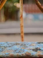Detailed macro photo of a rusty metal surface with exposed rust and peeling paint. Ideal for industrial design, vintage aesthetics