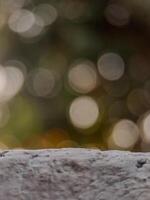 blurred background with soft, circular bokeh lights and a textured foreground. Perfect for serene designs. photo