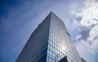 A cityscape of cloud reflecting on the building in Shinjuku Tokyo wide shot photo